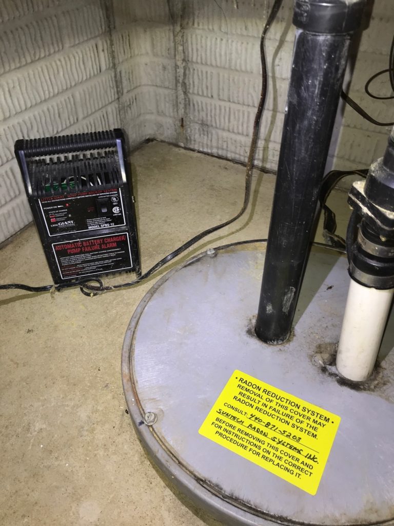 Radon Reduction System - Removal of this sump pit cover may result in failure of the radon reduction system. Consult radon mitigation installer before removing this cover for instructions on the correct procedure for replacing it.